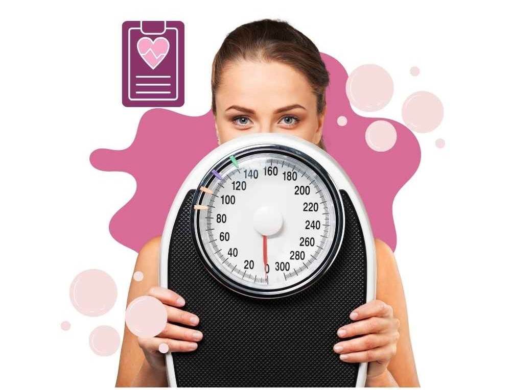 Woman holding a scale wondering how to get past a weight loss plateau