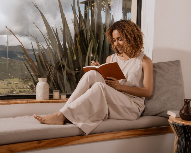 woman writing in brain fog journal